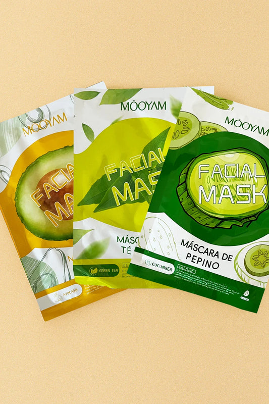 Three Mooyam facial mask packages on a beige background