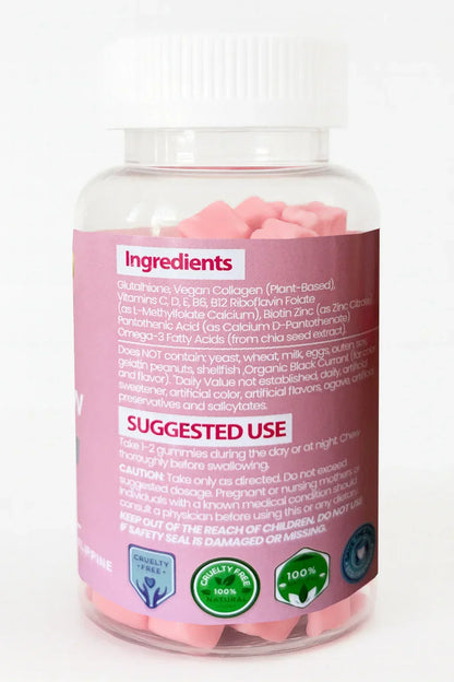 Bottiglia di integratori con capsule rosa e etichetta degli ingredienti su uno sfondo bianco