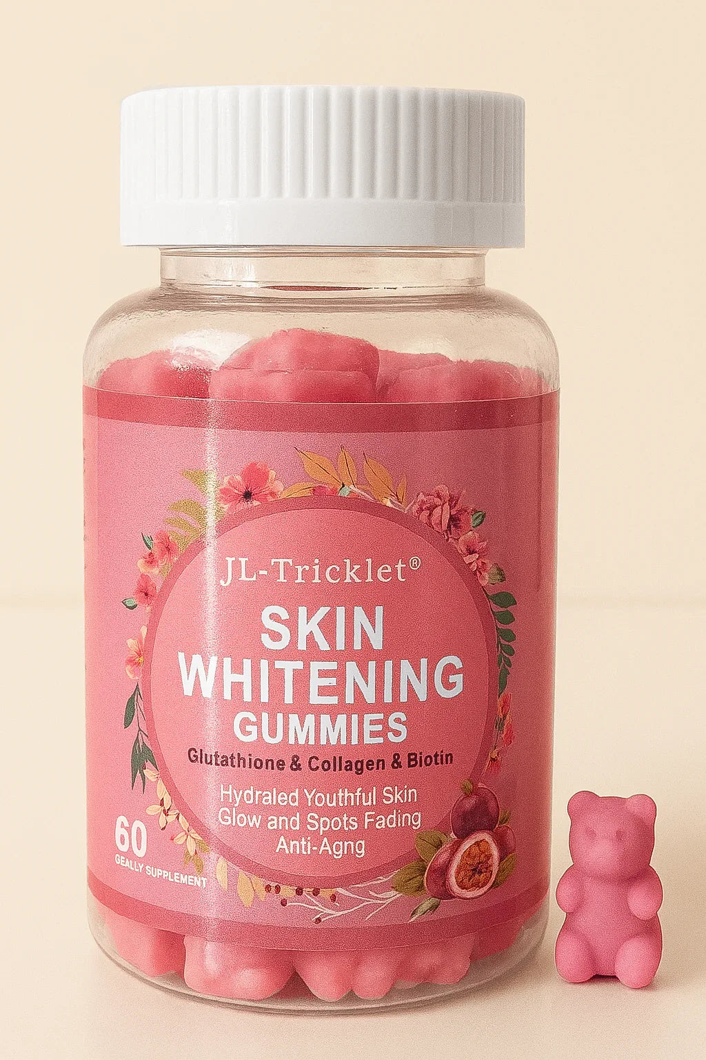 barattolo di jl tricklet gummy per sbiancamento della pelle con un piccolo orsetto di gomma rosa su uno sfondo beige