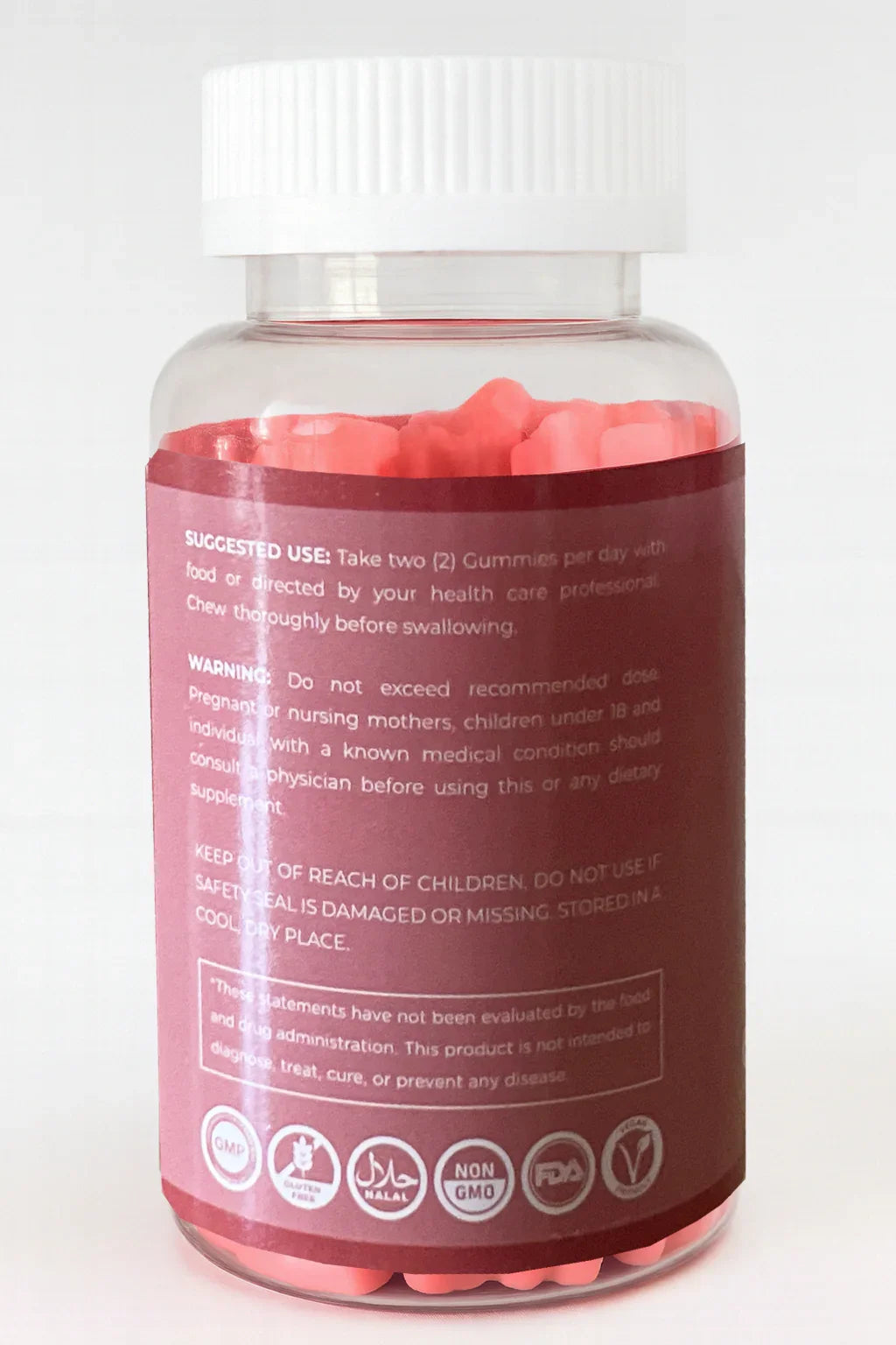 bottiglia di integratore con capsule rosa e etichetta su sfondo bianco